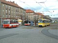 Souprava T3M 219+220 vyjíždějící z vozovny na odpolední špičku spolu s autobusy linky č. 30 na Slovanské alejileji 18. 11. 2005